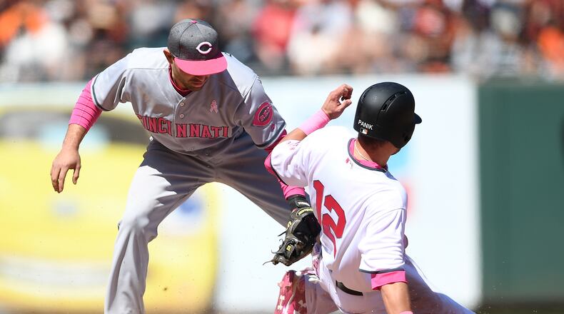 SAN FRANCISCO, CA - MAY 13: Joe Panik #12 of the San Francisco Giants steals second base sliding in ahead of the tag of Jose Peraza #9 of the Cincinnati Reds in the bottom of the eighth inning at AT&T Park on May 13, 2017 in San Francisco, California. (Photo by Thearon W. Henderson/Getty Images)