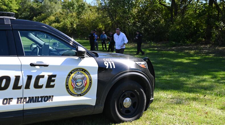Pictured is Hamilton Superintendent Mike Holbrook leaving walking toward the Garfield Middle School parking lot after a report of a body was found Thursday afternoon, Oct. 3, 2024, in a wooded area next to the school's property. MICHAEL D. PITMAN/STAFF