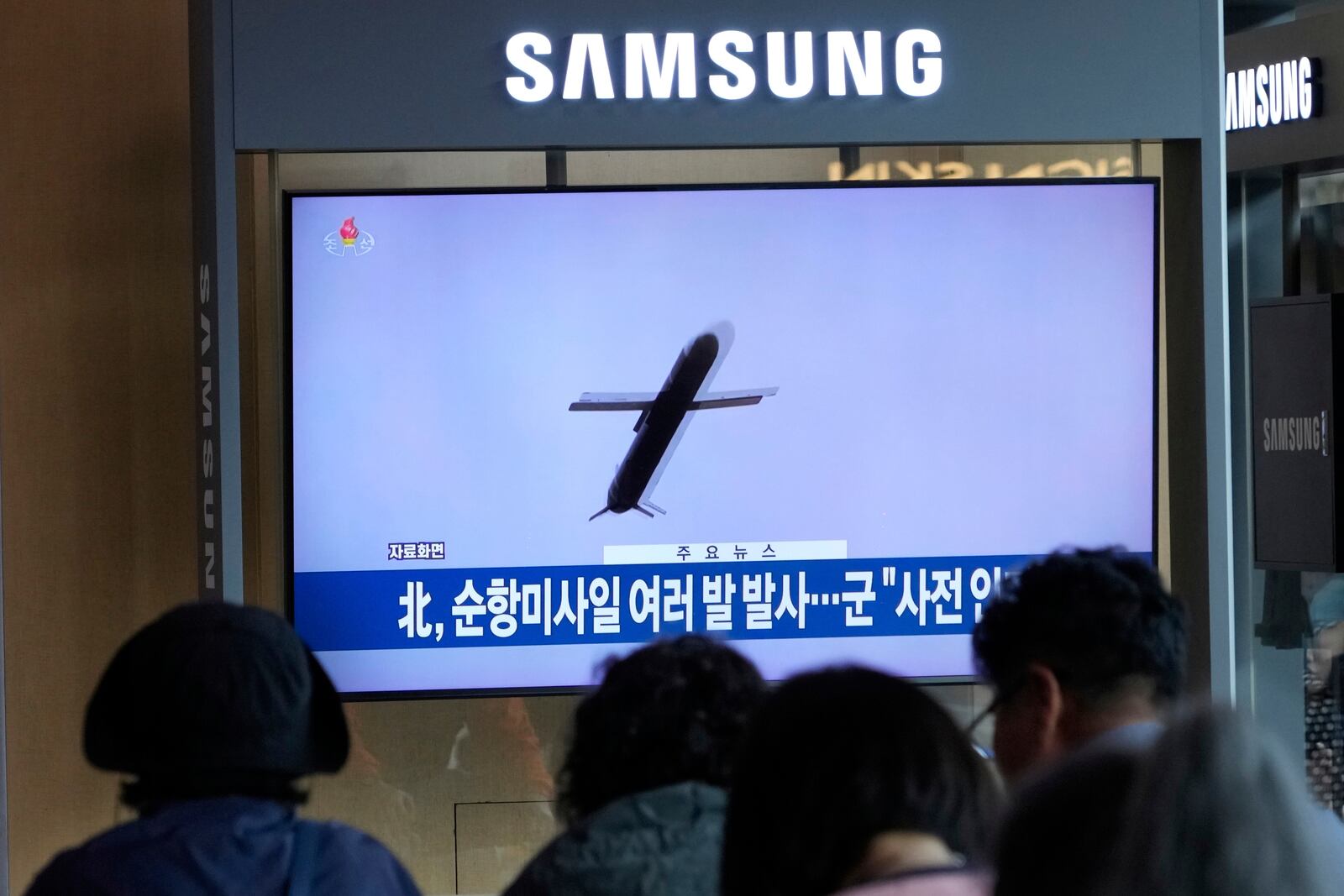 A TV screen shows a file image of North Korea's missile launch during a news program at Seoul Railway Station in Seoul, South Korea, Thursday, May 22, 2025. (AP Photo/Ahn Young-joon)