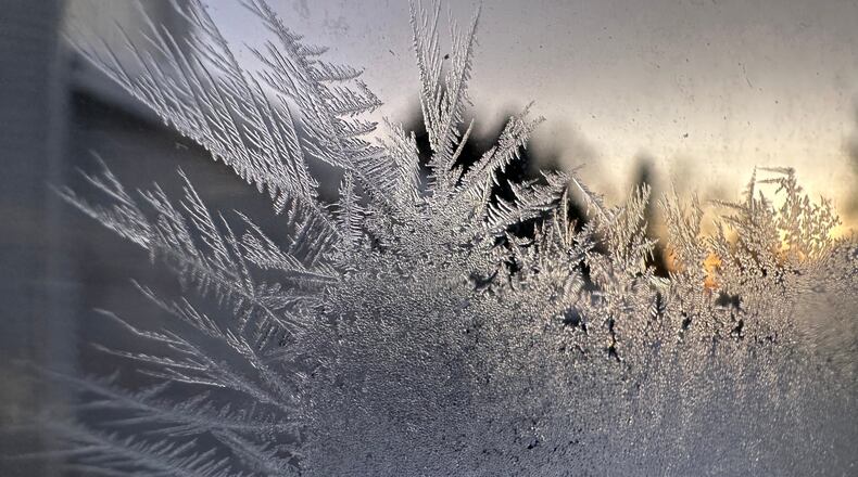 Ice crystals form inside a kitchen window in Lowville, New York, Saturday, Jan. 24, 2026. (AP Photo/Cara Anna)