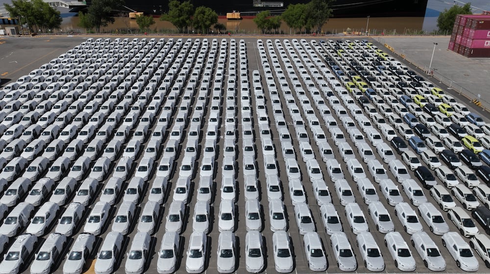 The BYD Changzhou car carrier is docked at Terminal Zarate in the Buenos Aires province of Argentina, Tuesday, Jan. 20, 2026, where hybrid and electric vehicles shipped from China are parked next to the ship. (AP Photo/Victor R. Caivano)