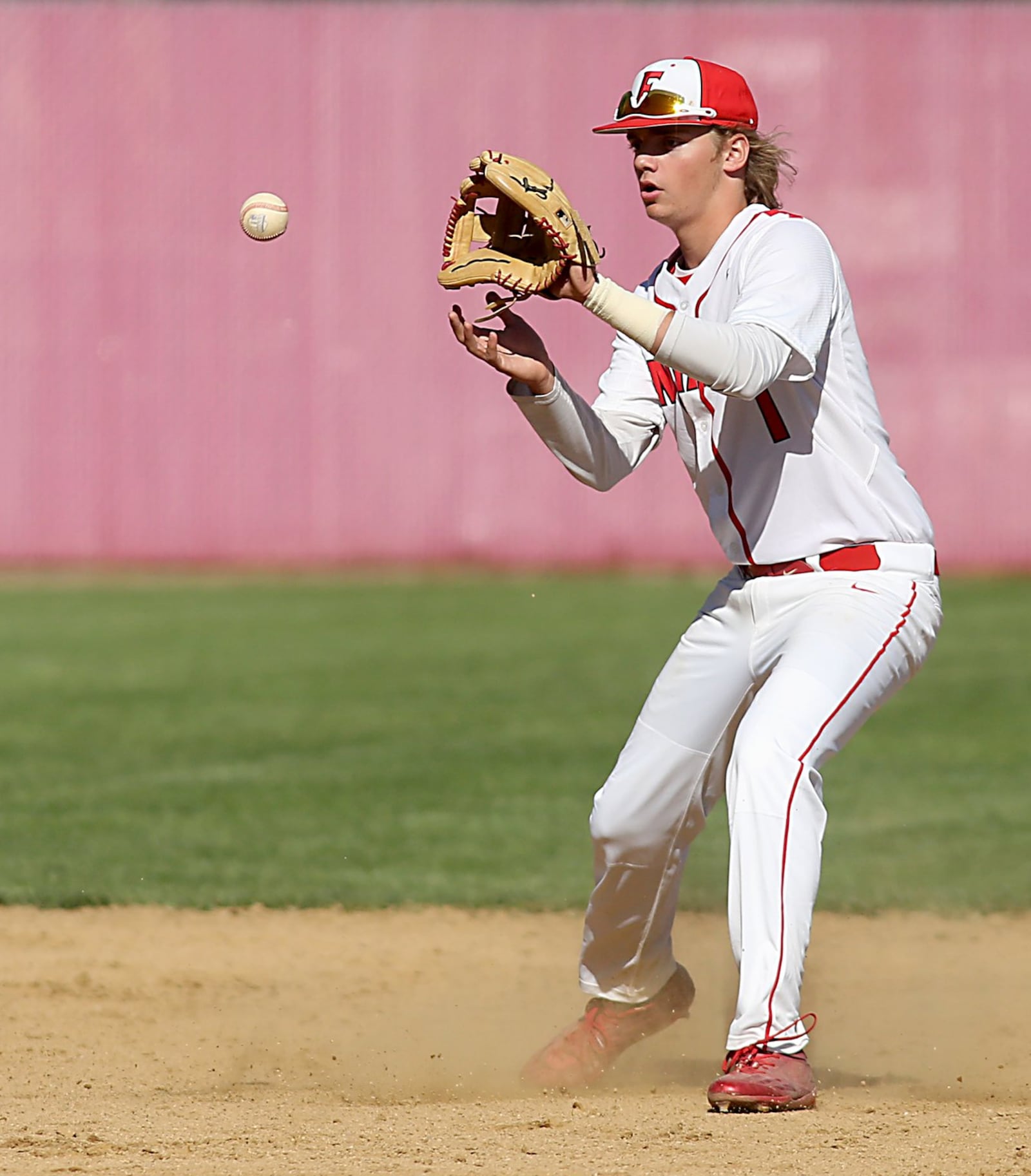 Fairfield shortstop Cameron Tenhundfeld fields a Hamilton ground ball during Sunday’s game at Joe Nuxhall Field in Fairfield. CONTRIBUTED PHOTO BY E.L. HUBBARD