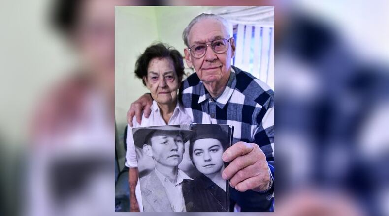 Mable and Justus Richardson, of Liberty Township, were married Dec. 24, 1942 in Kentucky. On Christmas Eve this year they will celebrate their 75th wedding anniversary. The photo they are holding was taken a few days before their wedding. NICK GRAHAM/STAFF