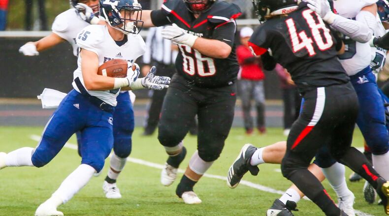 Edgewood running back Wade Phillips (25) looks for yards up the middle during their game at Franklin’s Atrium Stadium on Sept. 1, 2017. The host Wildcats won 49-21. GREG LYNCH/STAFF