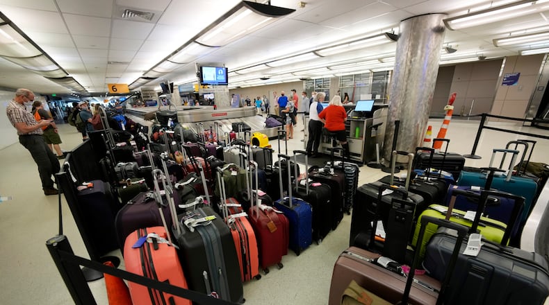 Thousands of Delta passengers were stranded at airports across the U.S., in some cases for several days, after the CrowdStrike IT outage shut down the airline’s scheduling systems. But the delays were just part of the nightmare for many travelers, who then had to wait longer to be reunited with their luggage. Baggage stacks up from delayed travelers in the baggage claim area in Denver International Airport Wednesday, June 16, 2021, in Denver. (AP Photo/David Zalubowski)