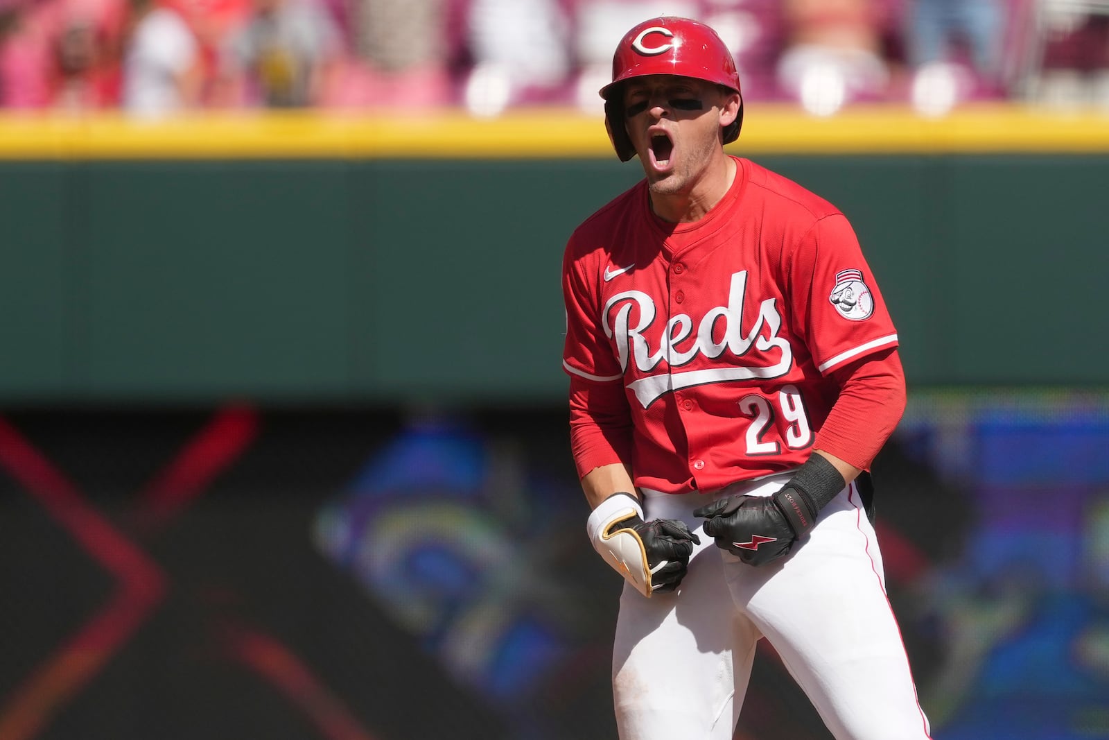 Cincinnati Reds' TJ Friedl reacts after hitting a one-run double in the ninth inning of a baseball game against the Toronto Blue Jays, Monday, Sept. 1, 2025, in Cincinnati. (AP Photo/Kareem Elgazzar)