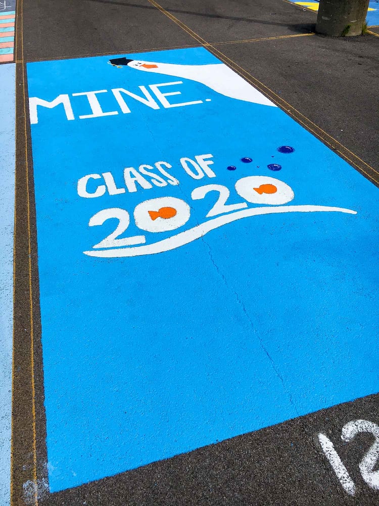 PHOTOS Lakota East seniors paint parking spots