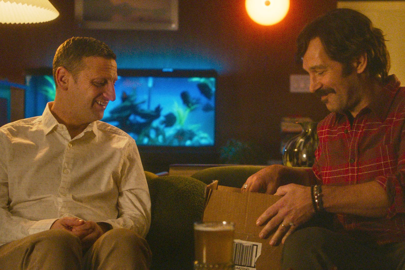 This image released by A24 shows Tim Robinson, left, and Paul Rudd in a scene from "Friendship." (A24 via AP)