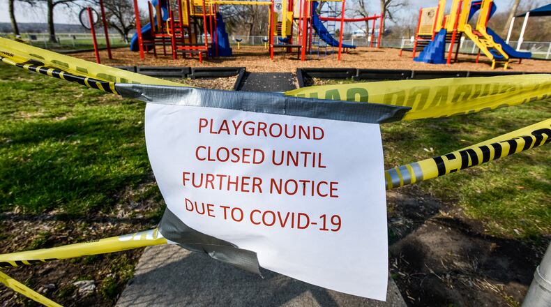 The playgrounds at Smith Park in Middletown has caution tape and signs indicating it is closed due to COVID-19. Many playgrounds in Butler County are off limits as a precaution against the spread of coronavirus. NICK GRAHAM/STAFF