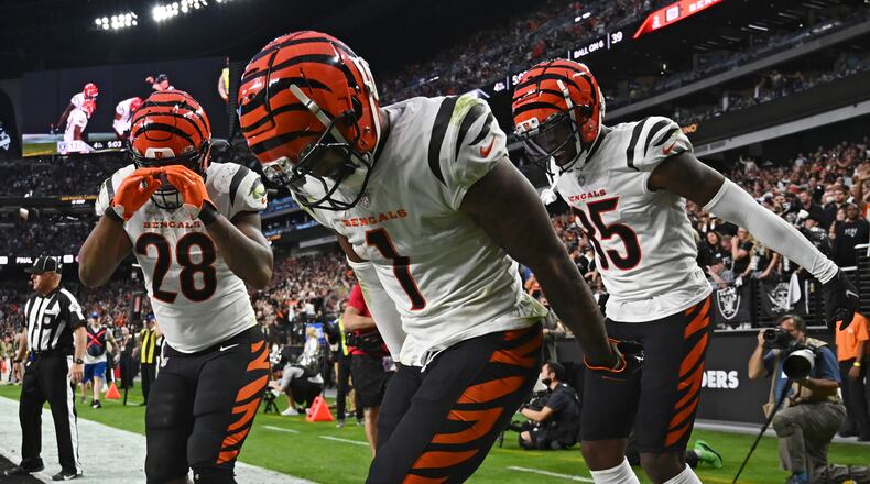 Cincinnati Bengals wide receiver Ja'Marr Chase (1) celebrates after scoring a touchdown against the Las Vegas Raiders during the second half of an NFL football game, Sunday, Nov. 21, 2021, in Las Vegas. (AP Photo/David Becker)