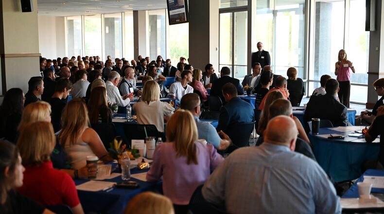 Miami University Hamilton and Butler Tech discussed the planned Advanced Manufacturing Hub at Knightsbridge at the former Vora Tech building, which hundreds attended at the Wednesday, Aug. 28, 2024, meeting. The hub is expected to open in 2026 and there are already about 25 business partners, including P&G, to be involved which educational opportunities span from entry-level real-world training to doctoral-level research. MICHAEL D. PITMAN/STAFF