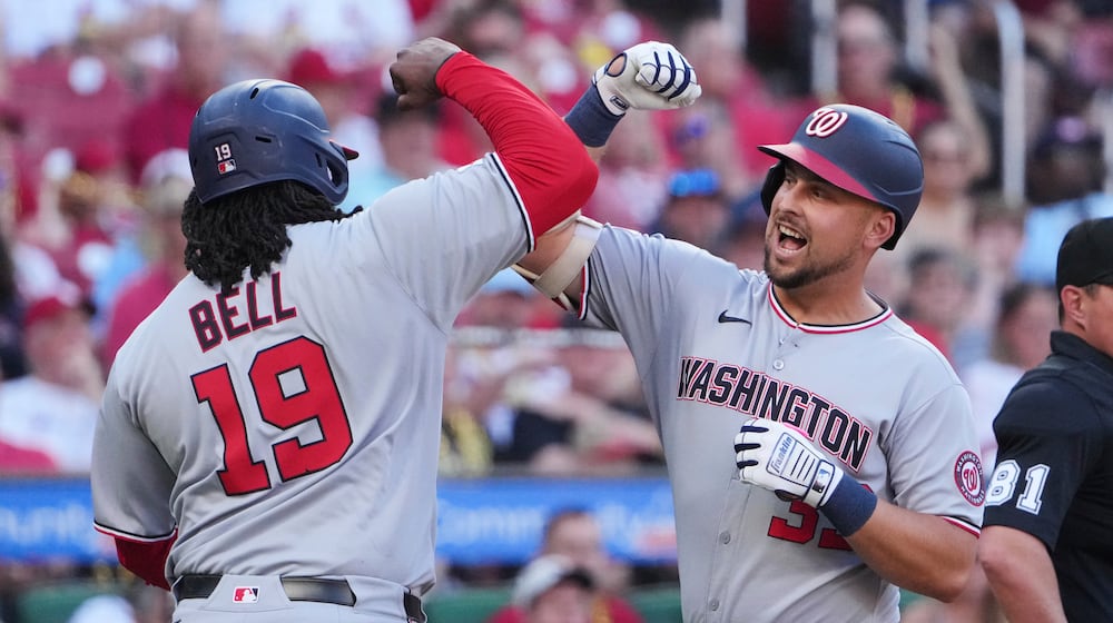 Washington Nationals' Nathaniel Lowe, right, is congratulated by teammate Josh Bell (19) after hitting a three-run home run during the first inning of a baseball game against the St. Louis Cardinals Wednesday, July 9, 2025, in St. Louis. (AP Photo/Jeff Roberson)