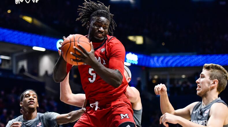 Miami’s Precious Ayah grabs a rebound during their basketball game against Xavier Wednesday, Nov. 28 at Xavier’s Cintas Center in Cincinnati. Xavier won 82-55. NICK GRAHAM/STAFF