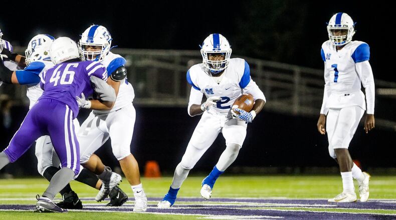 Hamilton’s Kaleb Johnson carries the ball during their football game against Middletown Friday, Oct. 18, 2019 at Barnitz Stadium in Middletown. Hamilton Big Blue defeated Middletown Middies 41-24. NICK GRAHAM/STAFF