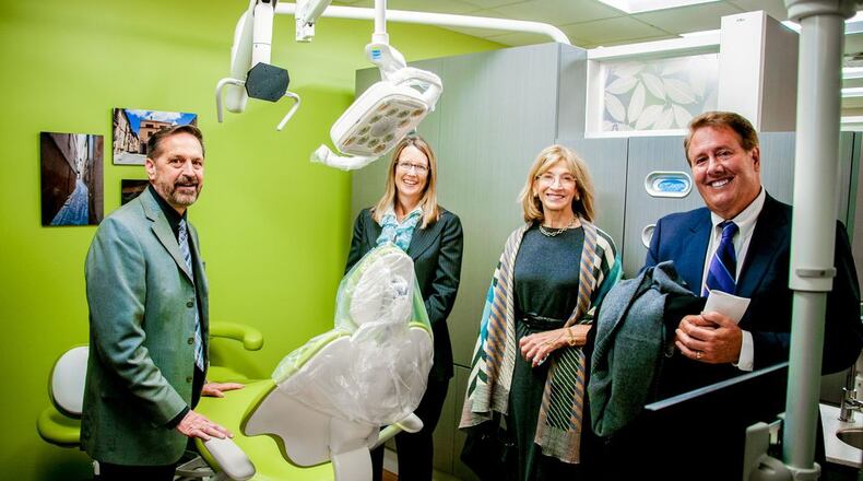 The Deaconess Association Foundation recently awarded more than $1 million in area grants to oral care programs designed to expand their reach to needy families who may be reluctant to seek care during the coronavirus. Among the grant recipients was Primary Health Solutions in Butler County. Shown are officials with the organization at the 2018 opening of a downtown Hamilton dental clinic for the needy. (File Photo\Journal-News)