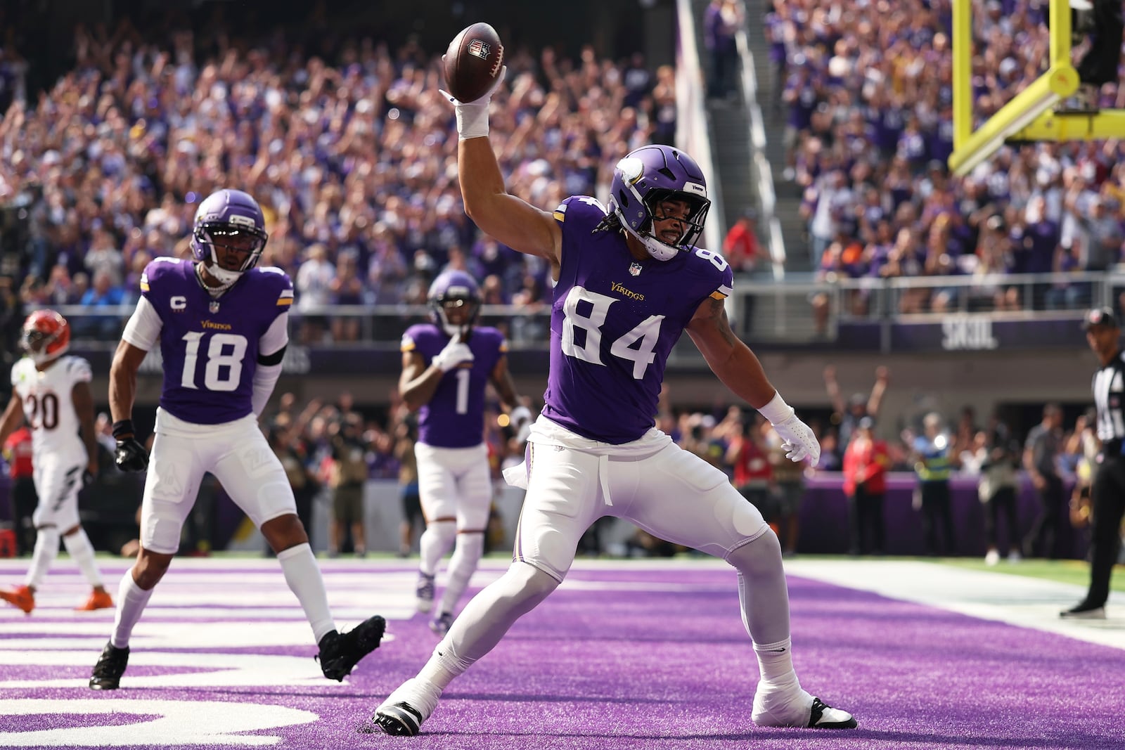 Minnesota Vikings tight end Josh Oliver (84) celebrates a touchdown during the first half of an NFL football game against the Cincinnati Bengals, Sunday, Sept. 21, 2025, in Minneapolis. (AP Photo/Matt Krohn)