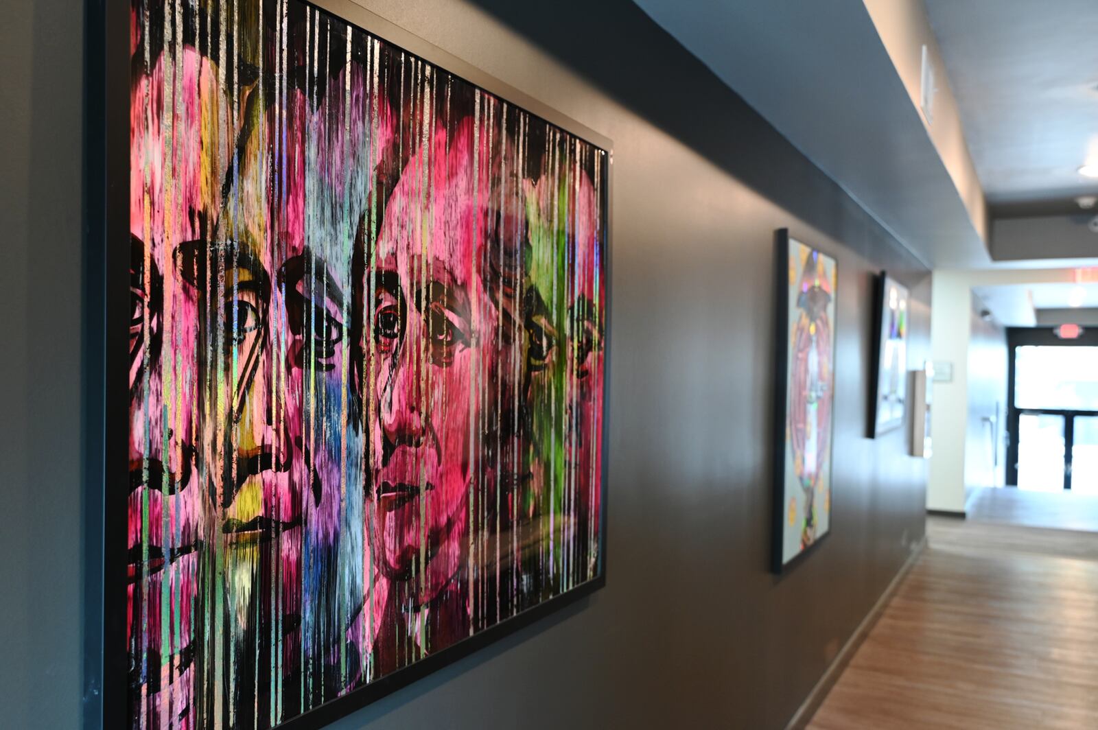 Kentucky-based artist Shawn Voelker created five unique pieces of artwork for the lobby of Rossville Flats which opened near the end of 2023 on Main Street in Hamilton. Pictured is the piece inspired by the Alexander Hamilton StreetSpark mural seen at the corner of Main and D streets at Armstead Park. MICHAEL D. PITMAN/STAFF
