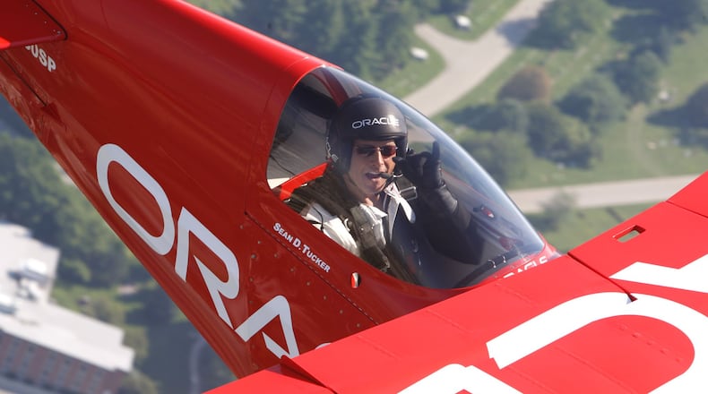 Sean D. Tucker in a photo flight over Dayton. TY GREENLEES / STAFF