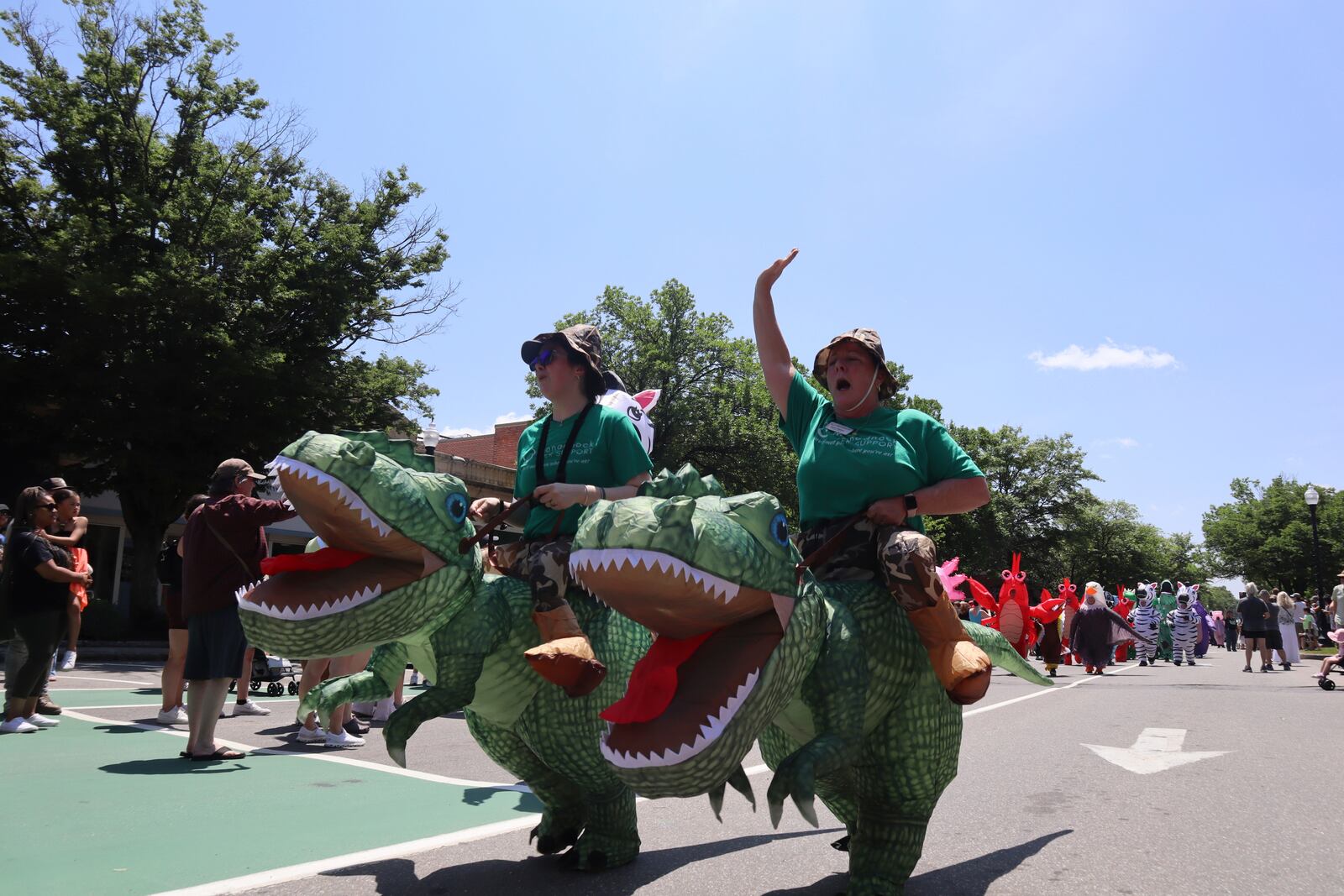 Crowds dressed in inflatable costumes participate in the 'Rhino Rumble Road Race' to celebrate the 30th anniversary of the film 'Jumanji' in downtown Keene, N.H. on Saturday, June 21, 2025. (AP Photo/Leah Willingham)