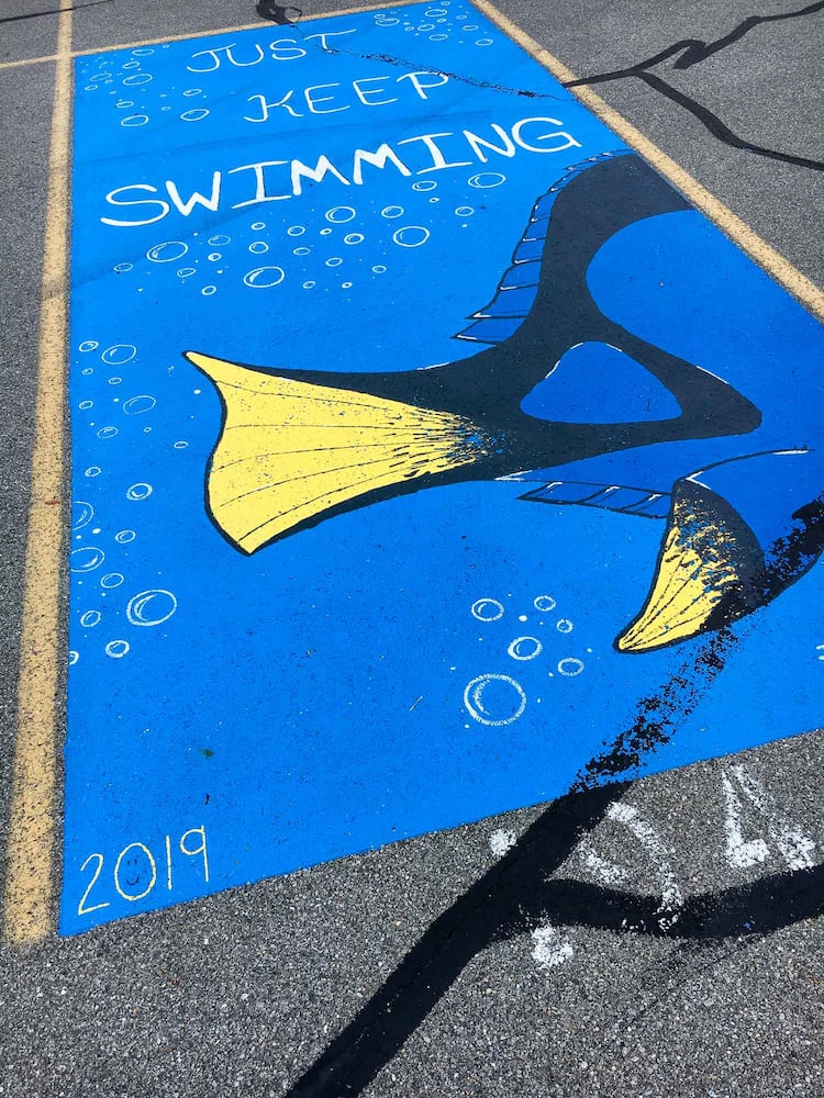 PHOTOS Lakota East seniors paint parking spots
