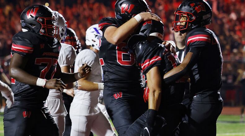 Lakota West celebrates a touchdown in Friday's season-opening win over St. Xavier. Nick Graham/STAFF