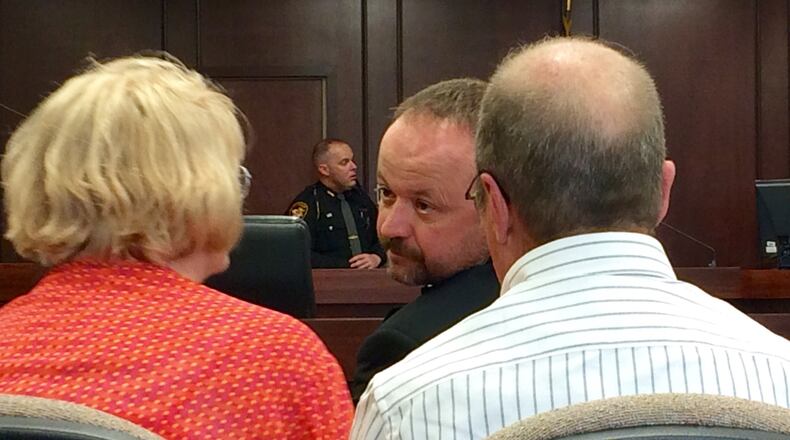 Douglas Gearhart talking to his family in court before he waived his preliminary hearing.