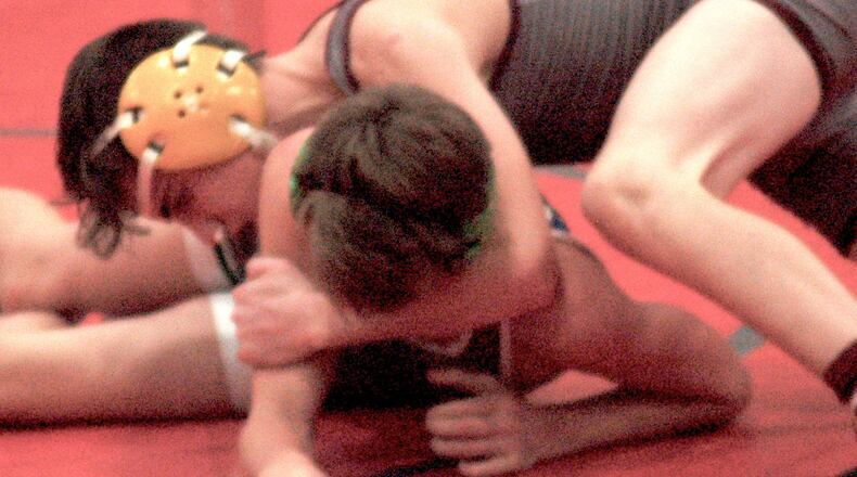 Ross 106-pounder Ben Breaker works on turning Chaminade Julienne’s Dylan Johns during the Division II, Region 15 finals Wednesday night at Chaminade Julienne High School. Breaker won by decision and the Rams advanced to the state tournament for the fourth time.
