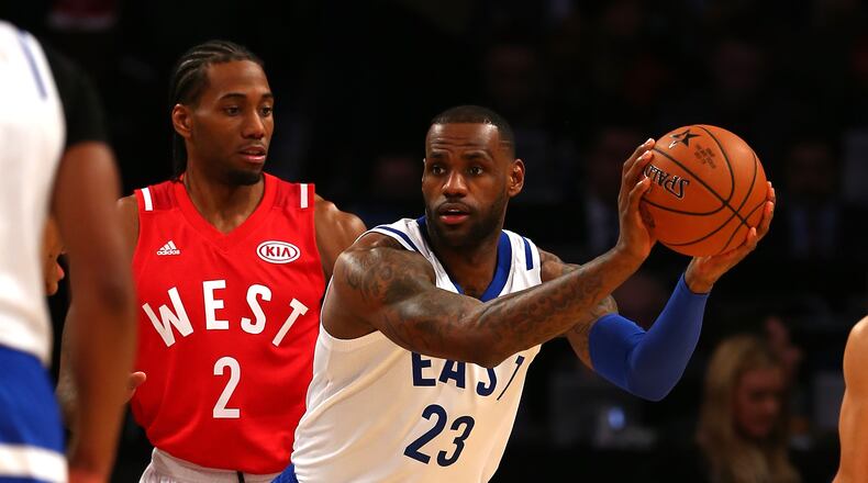 TORONTO, ON - FEBRUARY 14: LeBron James #23 of the Cleveland Cavaliers and the Eastern Conference handles the ball against Kawhi Leonard #2 of the San Antonio Spurs and the Western Conference in the second half during the NBA All-Star Game 2016 at the Air Canada Centre on February 14, 2016 in Toronto, Ontario. NOTE TO USER: User expressly acknowledges and agrees that, by downloading and/or using this Photograph, user is consenting to the terms and conditions of the Getty Images License Agreement.  (Photo by Elsa/Getty Images)
