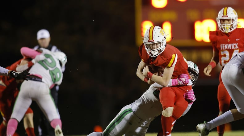 Fenwick's Connor Schmuelling carries the ball during their game against Badin on Friday, Oct. 14, 2022 at Bishop Fenwick High School. NICK GRAHAM/STAFF