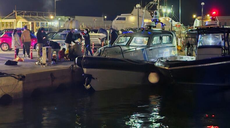Greek coast guard officers carry out rescue operations at a port on the eastern Aegean island of Chios, Greece, late Tuesday, Feb. 3, 2026, after a collision between a migrant speedboat and a coast guard patrol vessel killed multiple people, authorities said. (Pantelis Fykaris/Politischios.gr via AP)