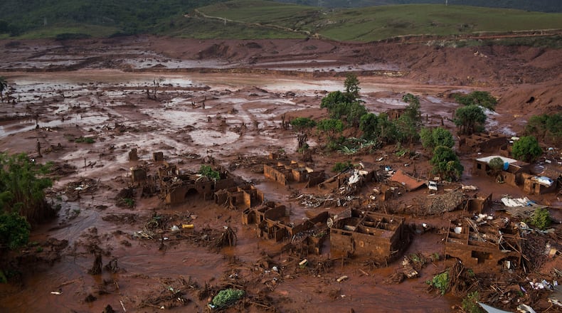 FILE - Debris is visible after a dam burst at the small town of Bento Rodrigues in Minas Gerais state, Brazil, Nov. 6, 2015. (AP Photo/Felipe Dana, File)