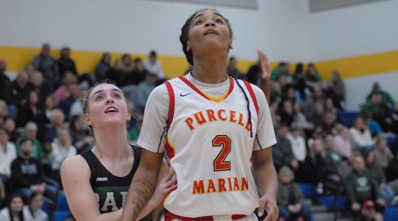 Badin's Hailey Weber and Purcell Marian's Dee Alexander fight for position during a free throw attempt on Friday night. Chris Vogt/CONTRIBUTED
