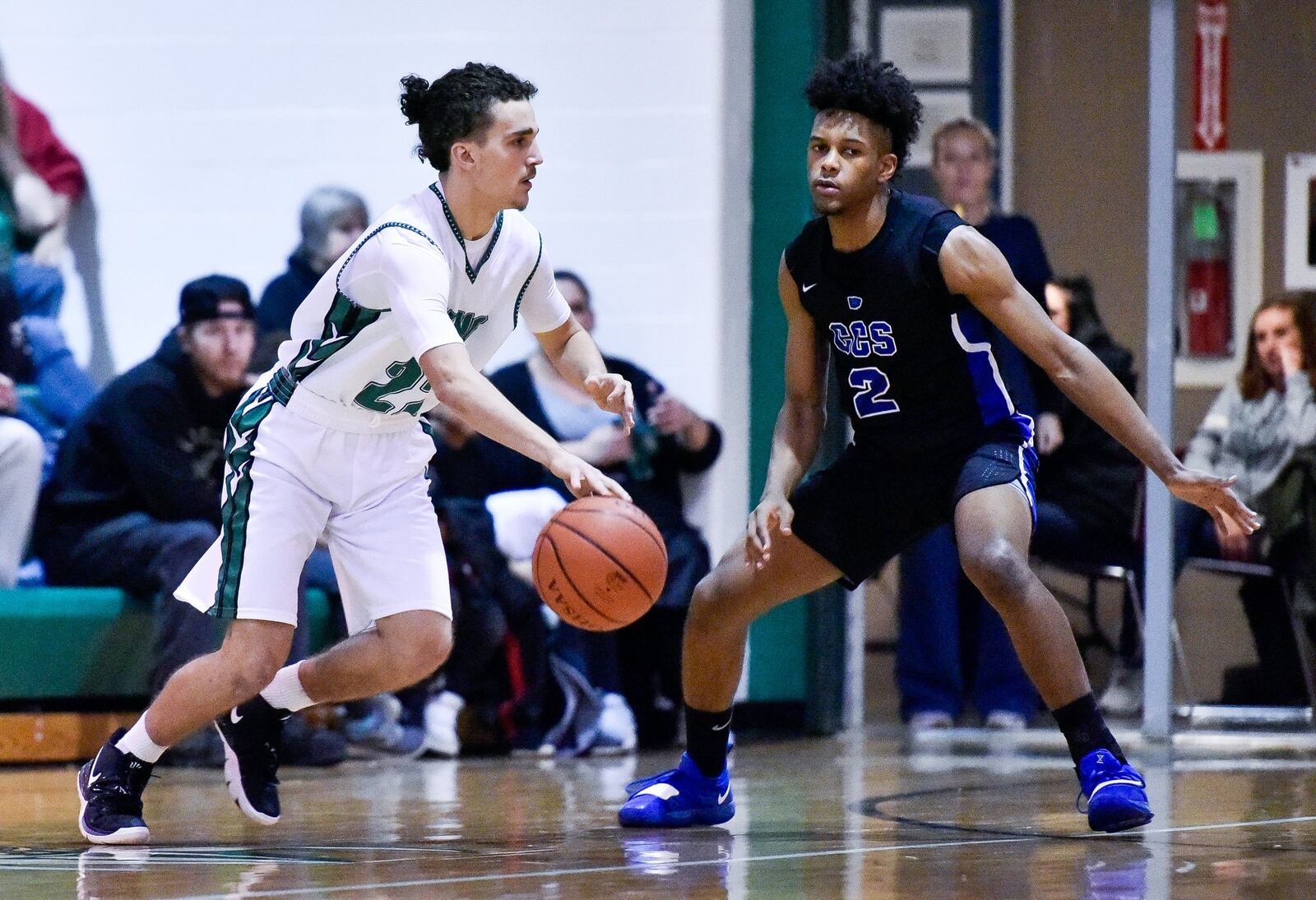 Cincinnati Christian’s Miguel Ringer defends New Miami’s Jordan Robinette as he dribbles during their game Dec. 14, 2018, at New Miami. CCS won 70-52. NICK GRAHAM/STAFF