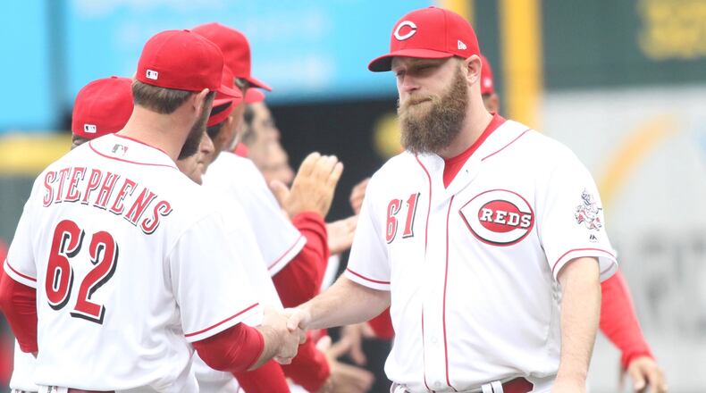 Reds reliever Kevin Quackenbush is introduced on Opening Day on March 30, 2018, before a game against the Nationals at Great American Ball Park.