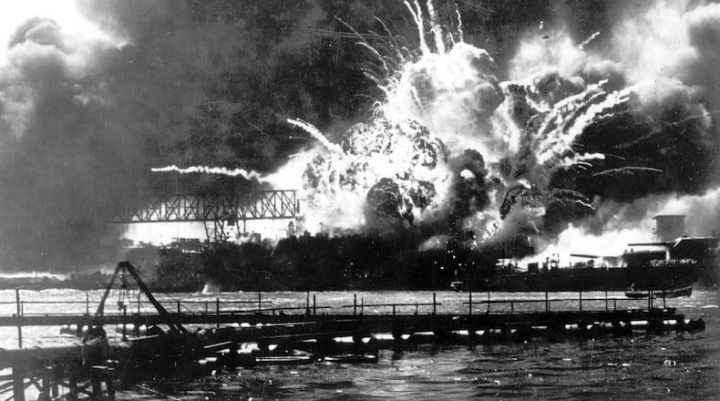 FILE - In this photo released by the U.S. Navy, the destroyer USS Shaw explodes after being hit by bombs during the Japanese surprise attack on Pearl Harbor, Hawaii, December 7, 1941. The Navy and the National Park Service will host a remembrance ceremony Thursday, Dec. 7, 2023, marking the 82nd anniversary of the attack on Pearl Harbor that launched the U.S. into World War II. (U.S. Navy via AP, File)