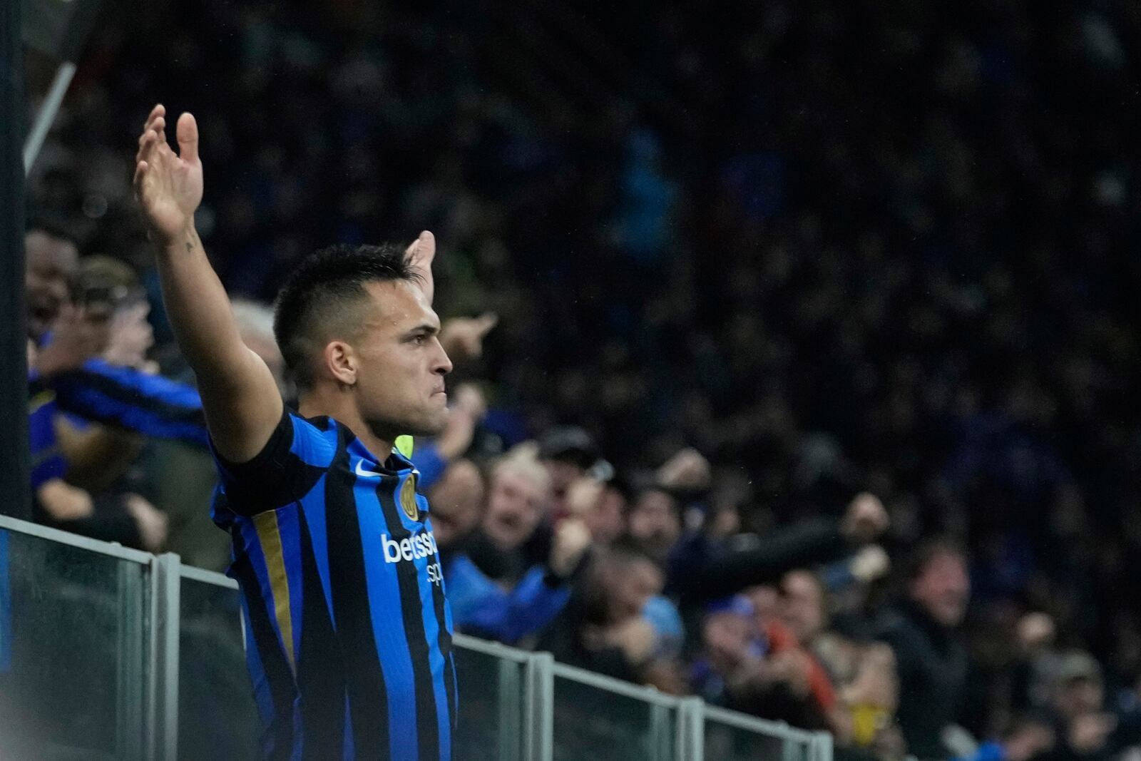 Inter Milan's Lautaro Martinez celebrates after scoring his side's opening goal during the Champions League quarterfinal second leg soccer match between Inter Milan and Bayern Munich at the San Siro stadium in Milan, Italy, Wednesday, April 16, 2025. (AP Photo/Luca Bruno)