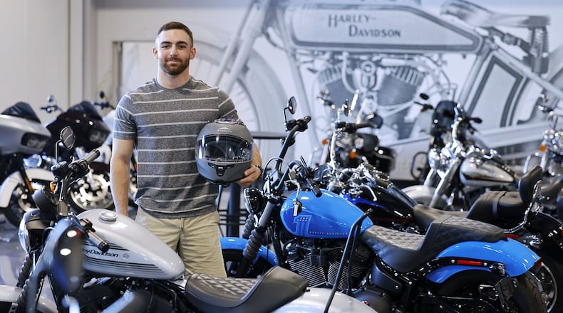 Motorcycle Ohio, a division of the Ohio Traffic Safety Office, presented Ricky McVety III, of Middletown, a “Saved by the Helmet” award Wednesday, 
Aug. 31, 2022 at Queen City Harley-Davidson in West ChesterTownship. The award is given throughout the year to those who survive serious crashes while wearing a helmet. On October 12,  2021, McVety was hit by an oncoming driver in a minivan who pulled in front of him at the intersection of Breiel Blvd. and Central Ave. in Middletown. McVety was hospitalized with serious injuries, but believes his helmet saved his life. NICK GRAHAM/STAFF