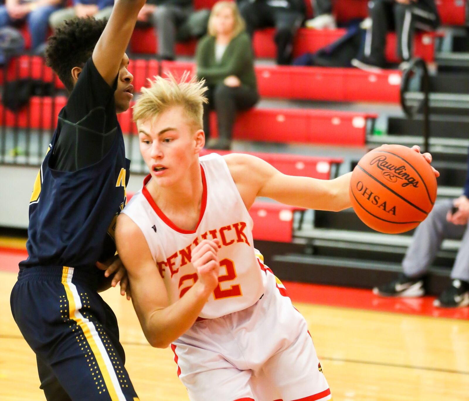 Fenwick forward C.J. Napier (22) drives past Monroe’s Tristan Backas during Tuesday night’s game at Fenwick. GREG LYNCH/STAFF