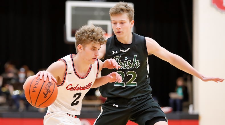 Cutline: Cedarville High School senior Trent Koning is guarded by Catholic Central junior Ian Galluch during their game on Tuesday night in Cedarville. Koning had 19 points as the Indians won 44-37. Michael Cooper/CONTRIBUTED