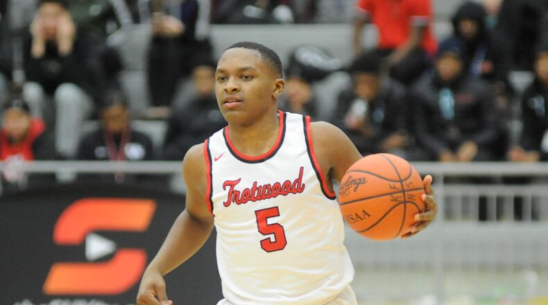 Keontae Huguely and Trotwood-Madison shot to No. 1 in the D-II boys state basketball poll. MARC PENDLETON / STAFF