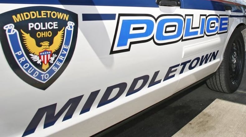 A woman told Middletown police she was getting out of her car at The Residence at Kensington Place when a man approached her with a gun and grabbed her purse.