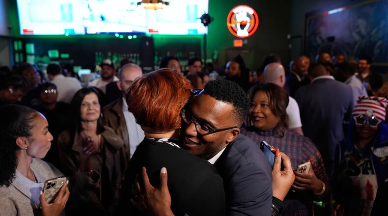Democratic 18th Congressional District candidate Christian Menefee, right, hugs an attendee during an election night watch party on Tuesday, Nov. 4, 2025, in Houston. (AP Photo/Ashley Landis)