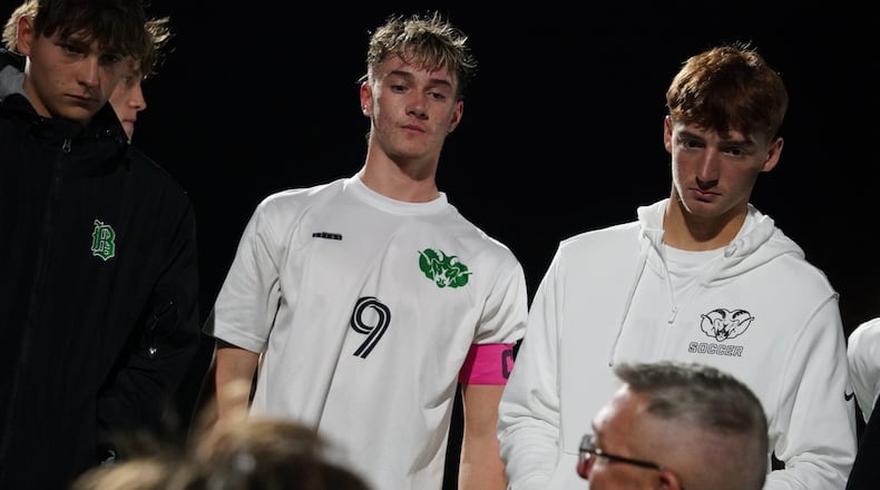 Badin’s Luke Hickey (9) looks on while his father, and coach, Eric Hickey talks during halftime of a recent postseason game. CHRIS VOGT / CONTRIBUTED