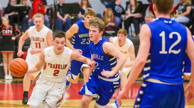 Franklin guard Payton Knott (2) drives up the court in a game against visiting Brookville on Feb. 7. GREG LYNCH/STAFF