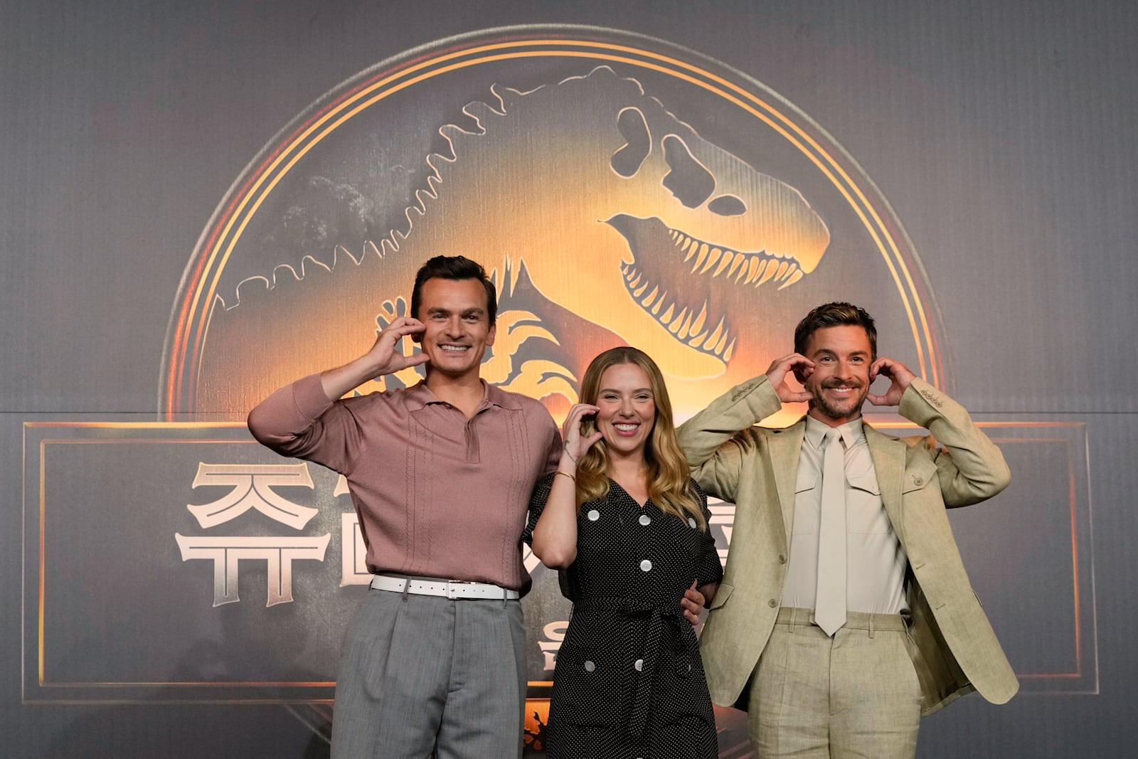 Actor Rupert Friend, left, actress Scarlett Johansson and actor Jonathan Bailey, right, pose during a press conference to promote their latest movie "Jurassic World Rebirth" in Seoul, South Korea, Tuesday, July 1, 2025. (AP Photo/Ahn Young-joon)