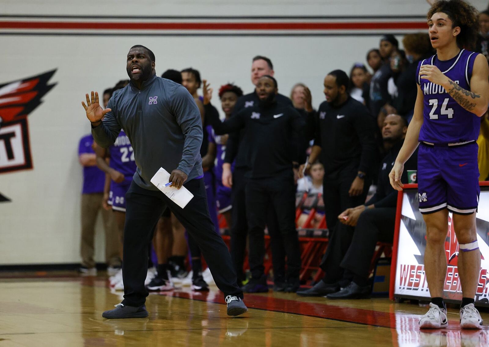 Middletown head coach Kelvin Moss cheers on his team during their Division I District basketball tournament game against Loveland Tuesday, Feb. 22, 2022 at Lakota West High School in West Chester Township. Middletown won 59-50. NICK GRAHAM/STAFF