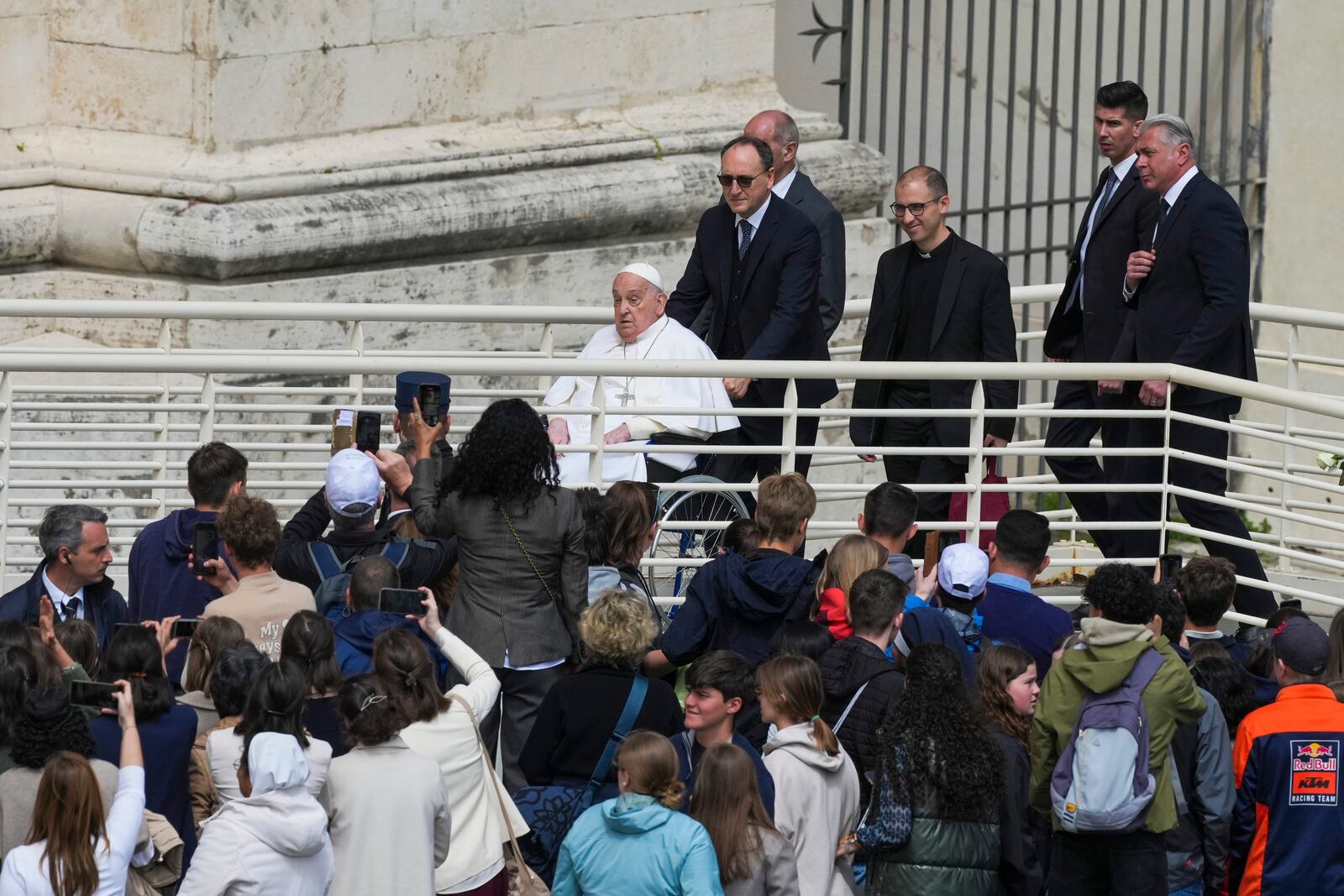 Pope Francis leaves at the end of the mass on Palm Sunday in St. Peter's Square at The Vatican, Sunday, April 13, 2025. (AP Photo/Alessandra Tarantino)