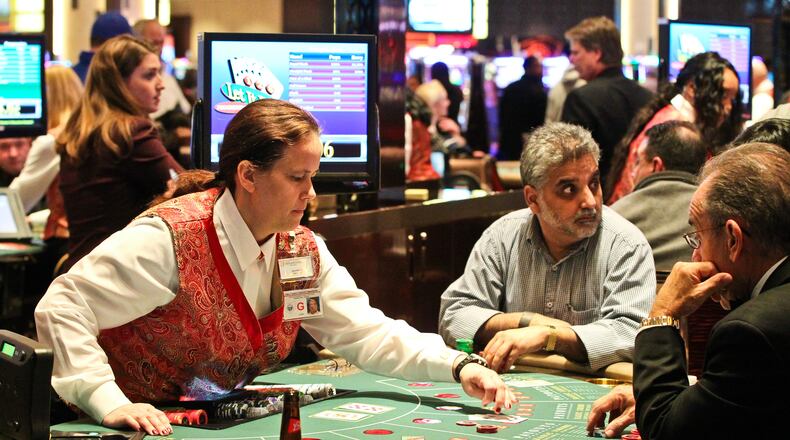 Card tables fill with guests during Horseshoe Casino Cincinnati's opening night Monday, March 4, 2013. NICK DAGGY / STAFF
