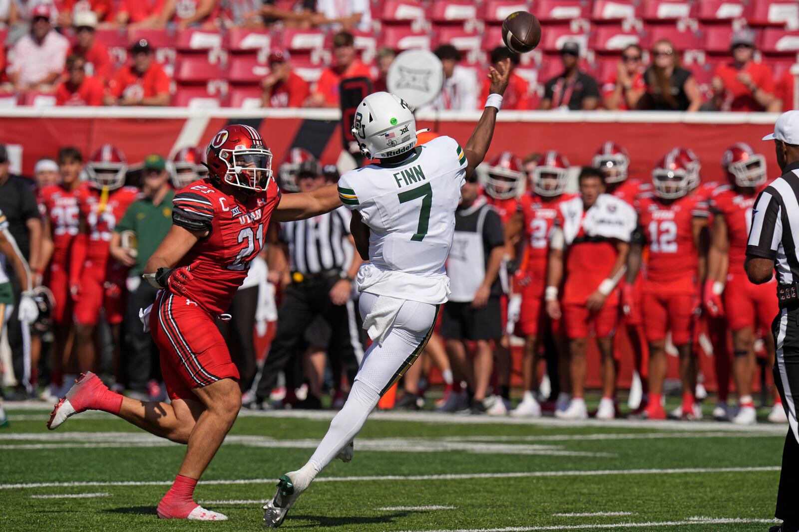 Utah linebacker Karene Reid (21) purses Baylor quarterback Dequan Finn (7) in the second half of their game Saturday, Sept. 7, 2024, in Salt Lake City. (AP Photo/Rick Bowmer)