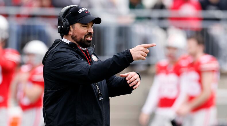 FILE - Ohio State head coach Ryan Day directs his team during an NCAA college spring football game on April 16, 2022, in Columbus, Ohio. Ohio State is hiking Day's annual salary to $9.5 million, as part of a two-year contract extension that will put him among the nation's highest-paid college football coaches. (AP Photo/Jay LaPrete, File)